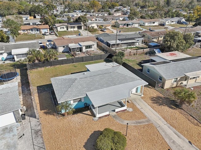 birds eye view of property with a residential view