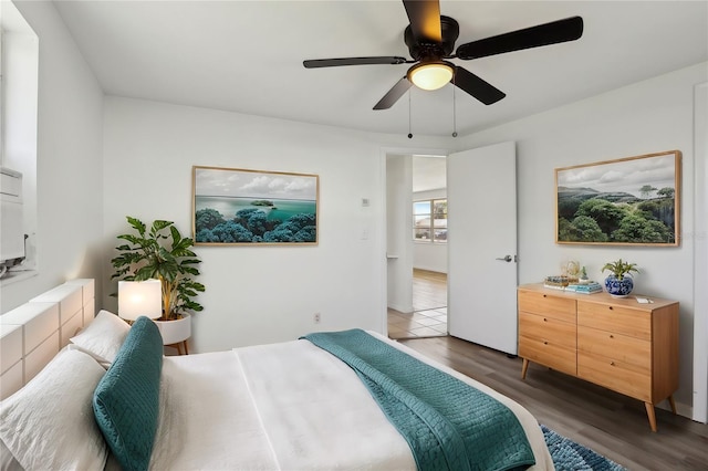 bedroom featuring a ceiling fan and wood finished floors