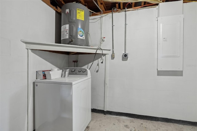 clothes washing area featuring concrete block wall, laundry area, electric panel, washer / clothes dryer, and water heater