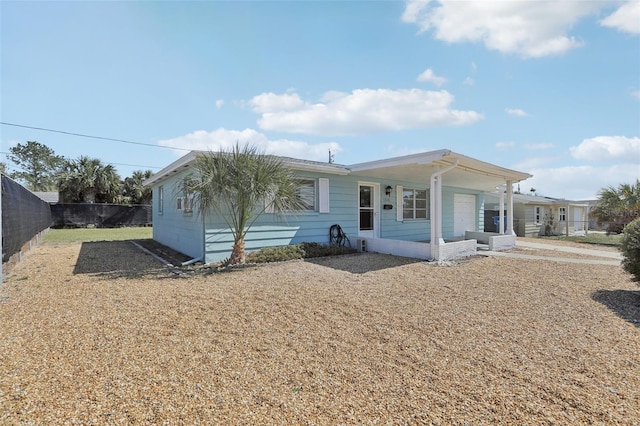 view of front of house featuring fence