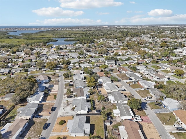 birds eye view of property featuring a residential view and a water view