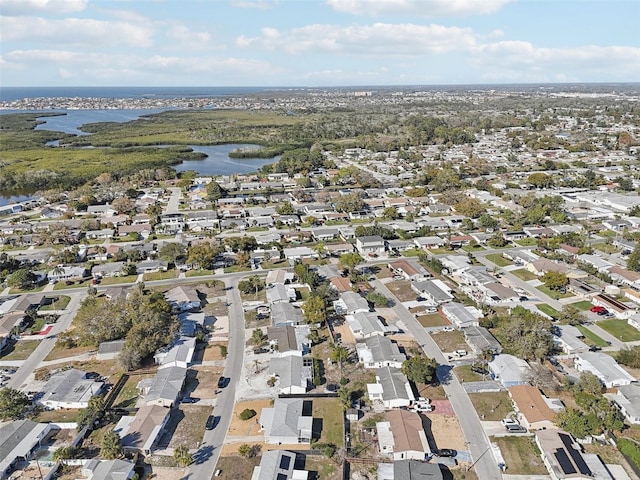 drone / aerial view with a water view and a residential view