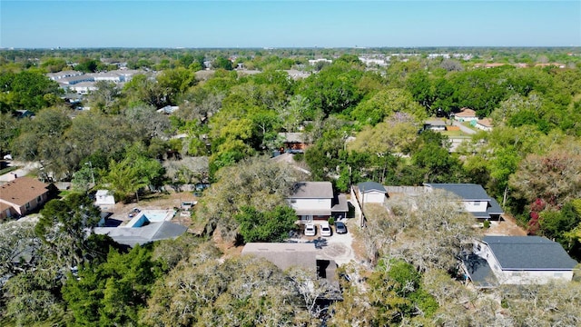 birds eye view of property featuring a forest view