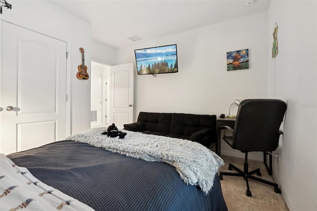 carpeted bedroom with baseboards