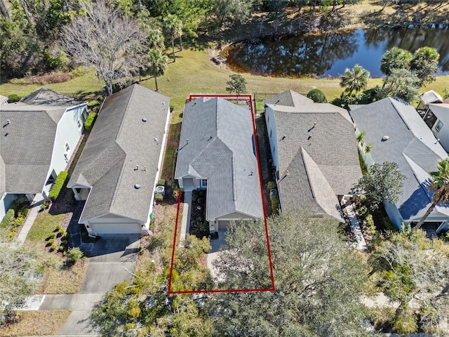 aerial view featuring a residential view and a water view