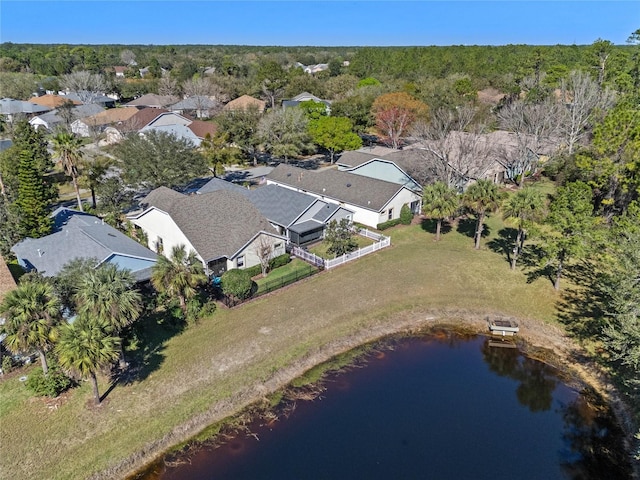 bird's eye view featuring a forest view and a residential view