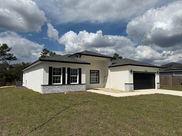 view of front facade featuring a garage, stone siding, a front lawn, and stucco siding