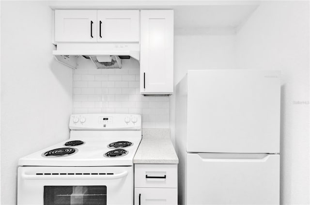 kitchen featuring white appliances, decorative backsplash, light countertops, under cabinet range hood, and white cabinetry