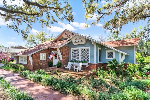 view of front of home featuring brick siding