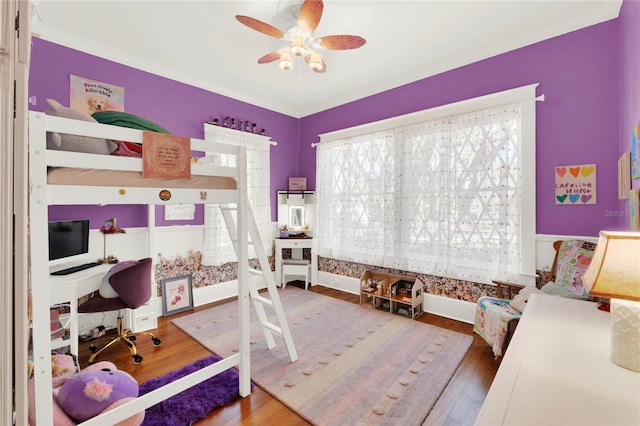 bedroom featuring wood finished floors and a ceiling fan