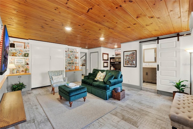 living area with recessed lighting, wooden ceiling, and a barn door