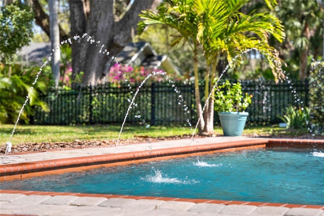 view of pool with fence