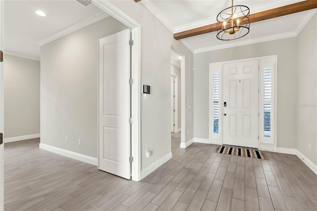 foyer with a chandelier, wood finished floors, and baseboards