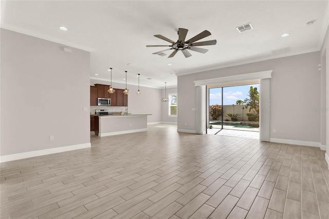 unfurnished living room with ceiling fan, light wood-style flooring, visible vents, and baseboards