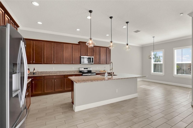 kitchen featuring stainless steel appliances, a sink, ornamental molding, light stone countertops, and wood tiled floor