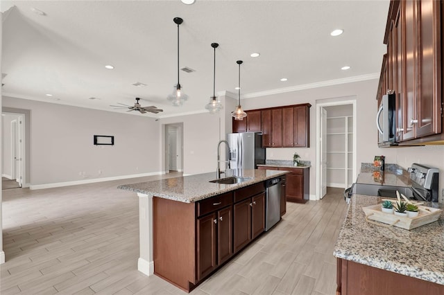 kitchen featuring ceiling fan, appliances with stainless steel finishes, wood tiled floor, crown molding, and a sink