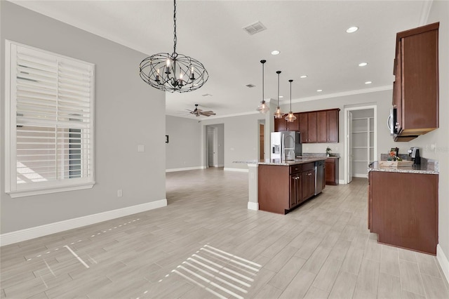 kitchen featuring visible vents, appliances with stainless steel finishes, open floor plan, light wood-style floors, and ceiling fan with notable chandelier