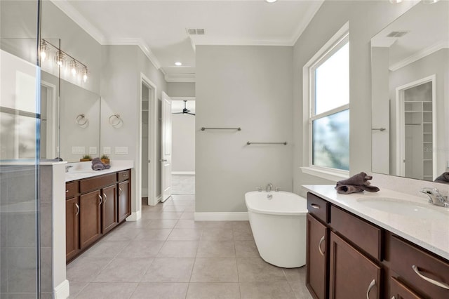 full bathroom featuring ornamental molding, visible vents, a sink, and tile patterned floors