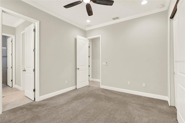 unfurnished bedroom featuring carpet floors, crown molding, recessed lighting, visible vents, and baseboards