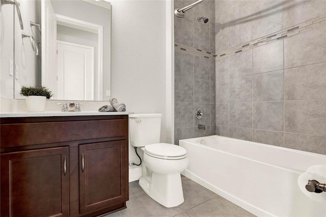 bathroom with washtub / shower combination, vanity, tile patterned flooring, and toilet