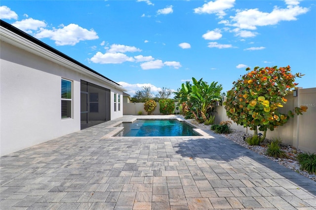 view of pool featuring a patio, a fenced backyard, and a fenced in pool