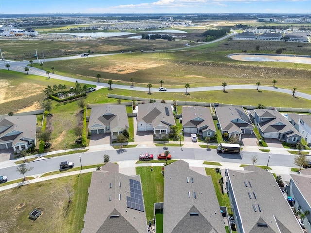 bird's eye view with a water view and a residential view