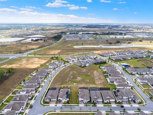 birds eye view of property with a residential view