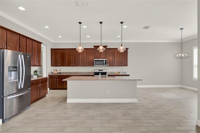 kitchen with appliances with stainless steel finishes, visible vents, and light stone counters