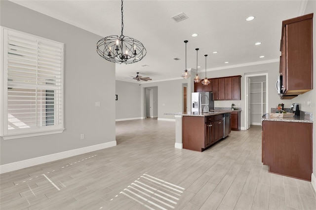 kitchen featuring light wood finished floors, visible vents, open floor plan, stainless steel appliances, and ceiling fan with notable chandelier