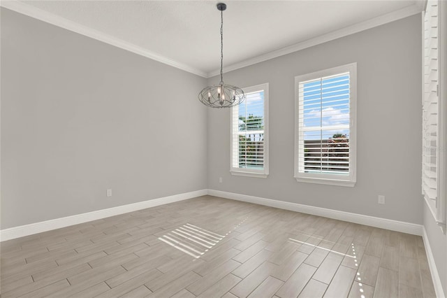 empty room with crown molding, light wood-style flooring, baseboards, and an inviting chandelier