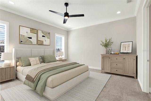 bedroom with visible vents, baseboards, a ceiling fan, light colored carpet, and ornamental molding