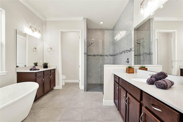 full bath with vanity, a shower stall, toilet, and crown molding