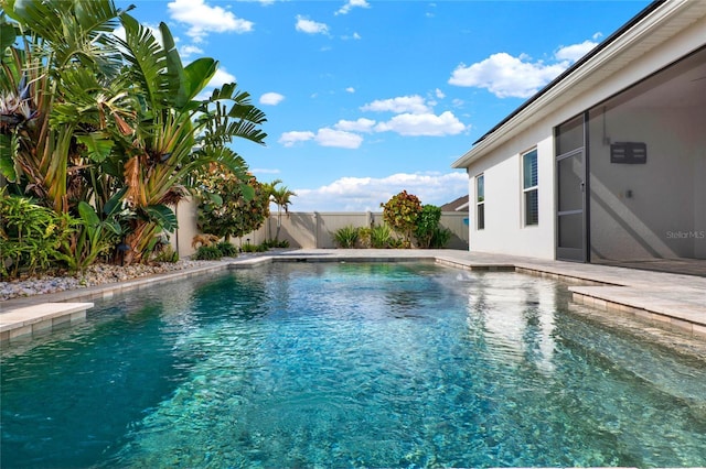 view of pool with a fenced backyard and a fenced in pool