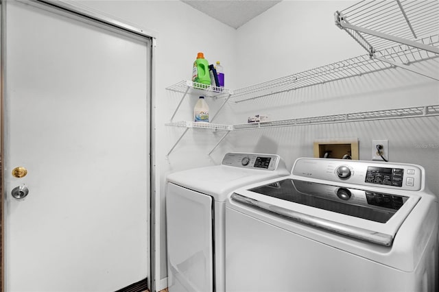 laundry area featuring laundry area and washing machine and clothes dryer