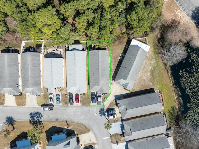 birds eye view of property with a residential view