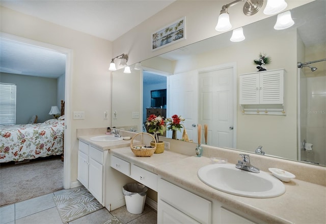 bathroom featuring walk in shower, a sink, ensuite bath, and double vanity