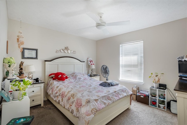 bedroom featuring ceiling fan and carpet flooring