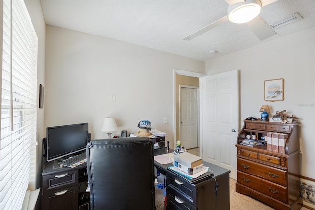 office with a ceiling fan, visible vents, and carpet floors