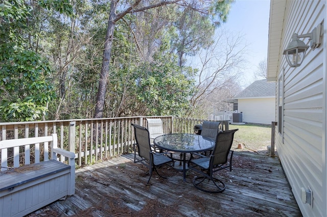 deck with cooling unit and outdoor dining space