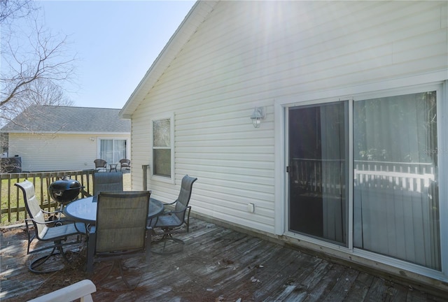 deck with outdoor dining area