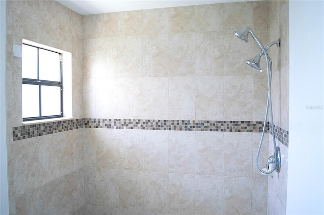 bathroom with tiled shower