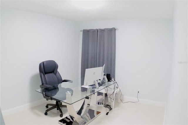 office space featuring baseboards