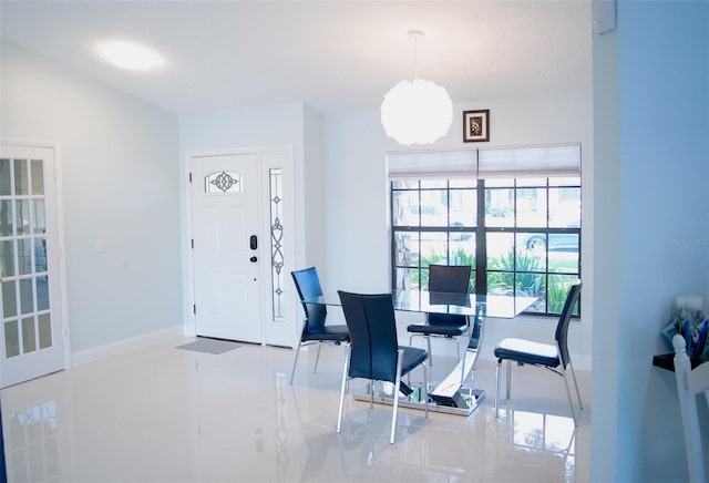 dining room featuring baseboards