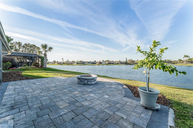 view of patio featuring a water view and an outdoor fire pit