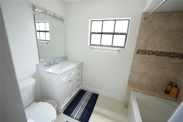 14712 Eagles Crossing Dr, Orlando, FL 32837 - bathroom with toilet, vanity, bathtub / shower combination, and baseboards