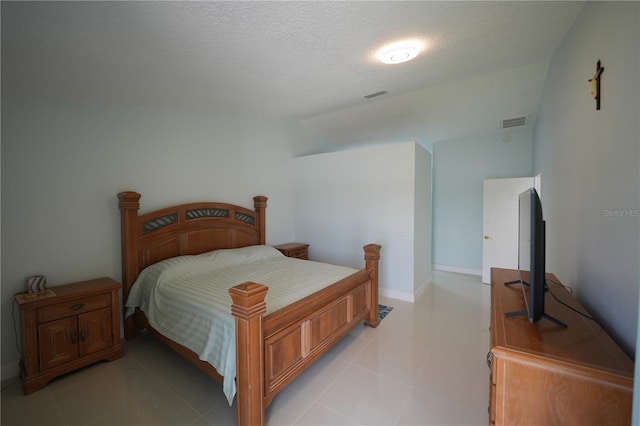 14712 Eagles Crossing Dr, Orlando, FL 32837 - bedroom featuring a textured ceiling and light tile patterned floors