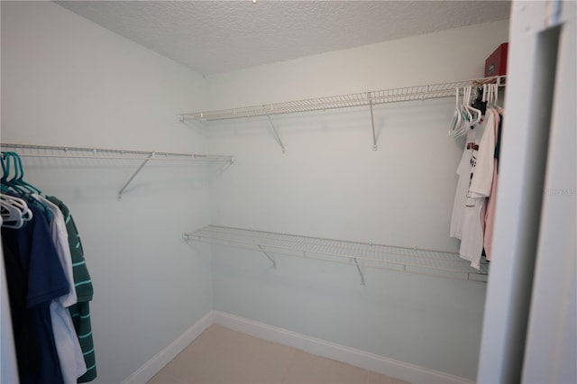 14712 Eagles Crossing Dr, Orlando, FL 32837 - spacious closet with light tile patterned floors
