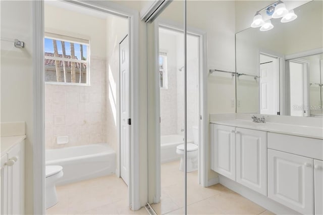 full bath with shower / bath combination, vanity, toilet, and tile patterned floors