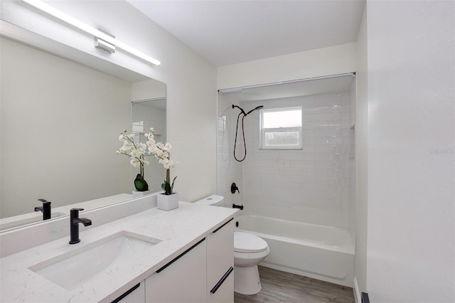 full bathroom featuring  shower combination, vanity, toilet, and wood finished floors