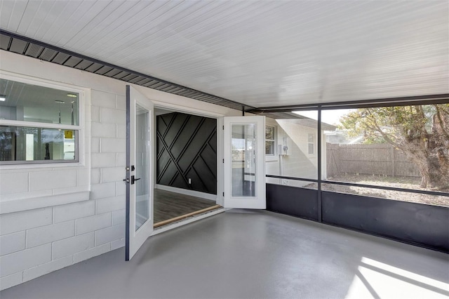 unfurnished sunroom with a wealth of natural light